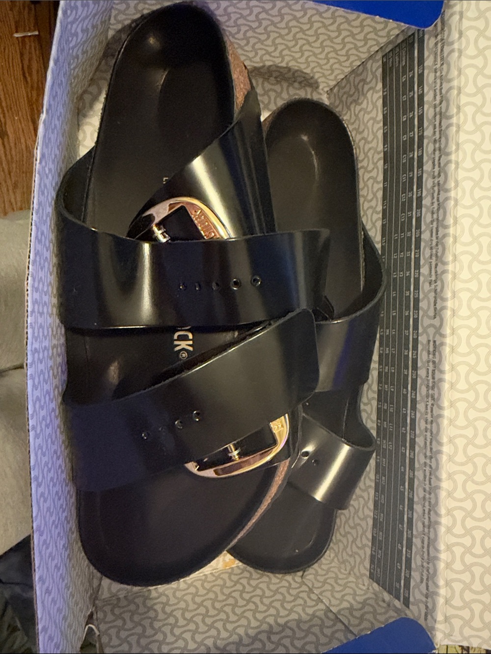 Birkenstock Black Slide Sandals with Gold Buckle